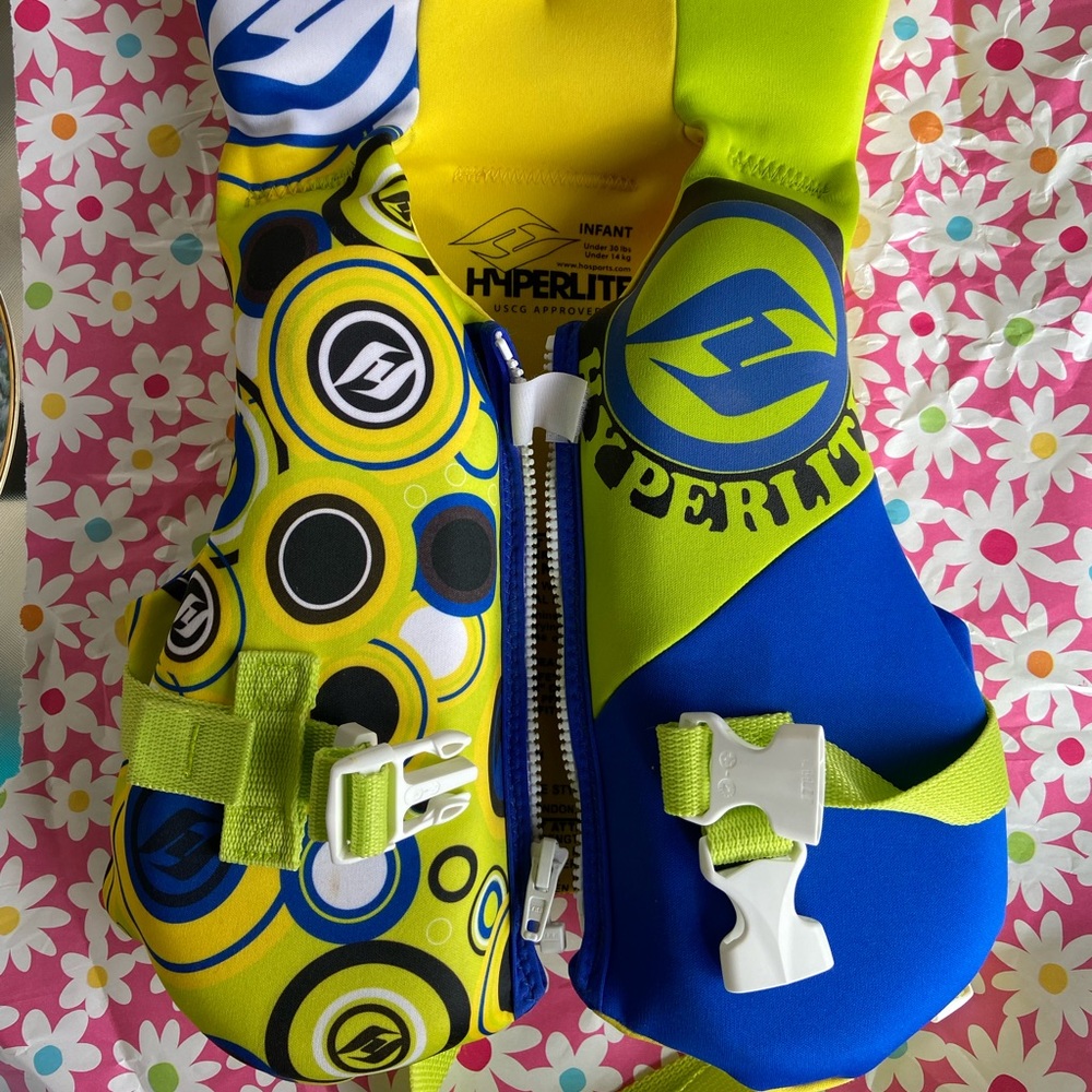 Infant hyperlite life jacket Excellent like new condition. Blue yellow and green